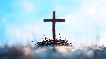 Cross is on a pile of thorns photo