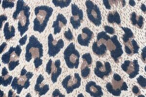 Texture leopard skin pattern wool rug background photo
