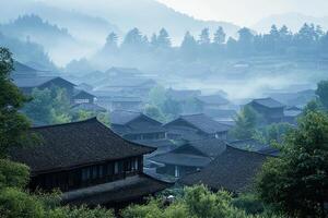 A misty morning in a village in china photo