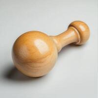 Wooden rattle toy, studio shot, light background photo