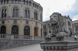 A lion statue in front of a building photo
