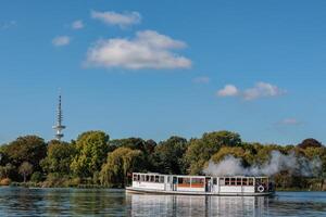 boat and tower in Hamburg and the alster river photo