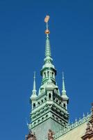 A building with a clock tower in hamburg photo