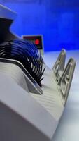 Blades of cash counting machine rotate quickly. Fifty euro banknotes and then one hundred euro bills fall on the holder of device. Close up. Blurred backdrop. video