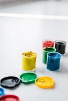 jars of gouache on windowsill - art painting and drawing lessons photo