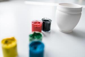 jars of gouache on windowsill - art painting and drawing lessons photo