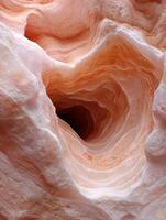 Abstract swirling rock formations in a canyon, natural texture background photo