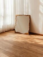 Stylish gold mirror in a sunlit room photo
