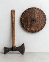 Medieval axe and shield on white background photo