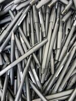 A sizable stack of black pens can be seen, each with a sleek design and smooth finish, perfect for writing or artistic endeavors, showcasing an array of patterns or styles photo