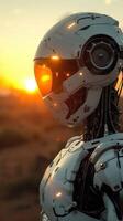 A futuristic robot stands in a desolate landscape, illuminated by the setting sun photo