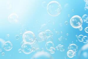 Soap bubbles floating in the air on a blue background photo