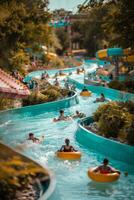 People enjoying a sunny day floating down a lazy river in an amusement park photo