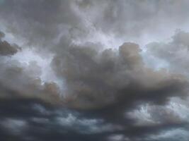 Dramatic, moody cloudscape. Perfect for backgrounds, weather reports, or atmospheric mood pieces. Intense grey and dark tones create photo