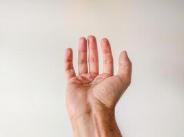 Closeup of a male hand, palm up, against a neutral background. Perfect for concepts of giving, receiving, or helping. Ideal for websites, apps, and presentations needing a clean, simple image. photo
