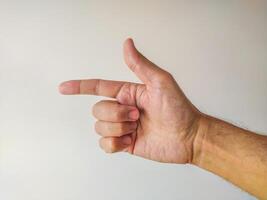 Closeup of a male hand gesturing, pointing with index finger. Clean, simple background ideal for presentations, websites, or instructional materials. Versatile image for various design projects. photo