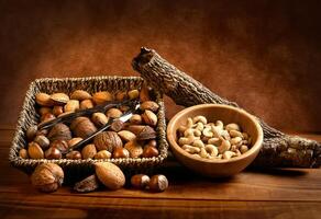 A basket of nuts and a wooden stick photo