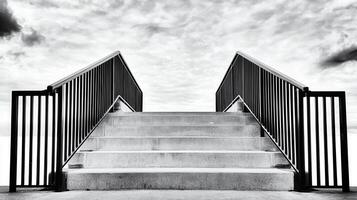 Black Metal Railings Concrete Steps Leading Upward to Sky photo