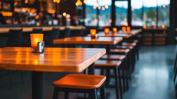 Warm inviting restaurant interior with candlelit tables and wooden chairs photo