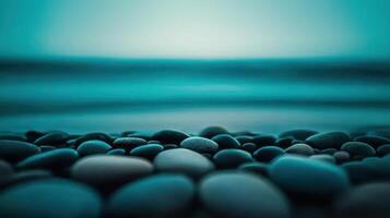 Serene Teal Ocean Scene Smooth Stones and Tranquil Waves photo