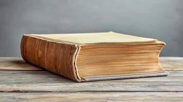 Antique Aged Book on Rustic Wooden Table Vintage Library History Knowledge photo