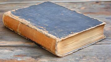 Antique Vintage Worn Book on Rustic Wooden Table Aged Textured Pages photo