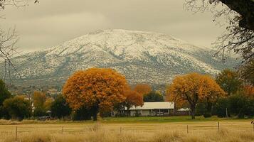 Scenic Autumn Landscape Snow capped Mountain Golden Trees Rural House photo