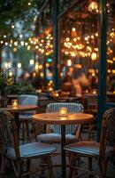 A restaurant with tables and chairs at night photo