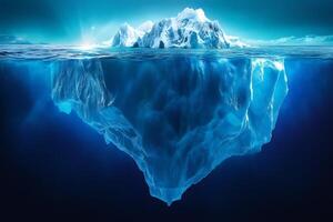 Huge iceberg floating in the ocean showing the tip and the hidden part photo
