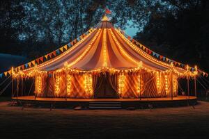 Illuminated circus tent glowing at twilight, inviting spectators to a magical night photo