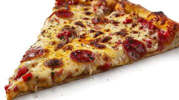A close-up of a single slice of pizza with pepperoni and red peppers photo