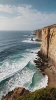 A scenic vertical view of coastal cliffs and calm waves, with an open sky and space available for text or overlays. photo