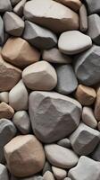 A minimalist vertical photograph of natural rock textures in soft, muted shades, conveying a tranquil and expansive design. photo