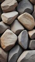 The minimalist vertical shot showcases natural rock textures in subdued hues, evoking a calm and open atmosphere. photo