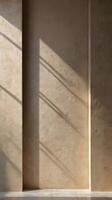 An abstract vertical backdrop with subtle shadows and light patterns on a neutral wall, offering room for creative design additions. photo