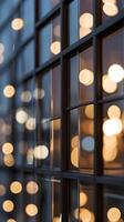 A vertical photo of glass windows reflecting soft light, creating geometric patterns with blank sections for copy space.
