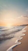 A vertical image showcasing a still seashore, with waves softly touching the sand, framed by muted pastel shades and a spacious sky for copy. photo