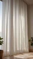 A vertical composition highlighting the fine folds of sheer white curtains, softly lit by daylight, with clear space for text overlay. photo