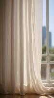 A tranquil vertical view of sheer white curtain folds, bathed in soft daylight, with open space perfect for text placement. photo