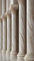 Close-up of vertical marble pillars with intricate veins and a clean, neutral background offering ample copy space. photo