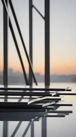 A vertical image of smooth steel beams arranged in a minimalist style, with sharp lines and ample negative space for text. photo