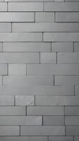 A minimalist vertical background of smooth gray tiles in a linear arrangement, ideal for adding copy in the open spaces. photo