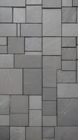 A vertical composition of gray stone tiles laid out in a linear design, offering clean lines and clear areas for copy. photo