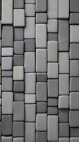 A vertical background of smooth gray stone tiles arranged in a linear pattern, perfect for text overlays with copy space. photo