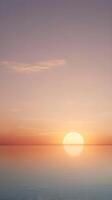 A vertical composition of a peaceful pastel sunrise over the horizon, with open space for text or design use. photo