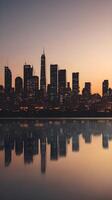 A peaceful vertical image of an urban skyline at dusk, with soft colors and calm reflections, leaving space for text in the sky. photo