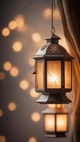 A vertical composition of a softly lit lantern hanging in front of a blurred neutral background, leaving ample room for text. photo