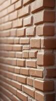 A vertical image of a smooth, neutral-toned brick wall, providing a minimalist backdrop perfect for adding text or design. photo