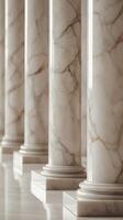 A high-detail vertical shot of sleek marble columns in neutral shades, featuring soft reflections and clear space for text. photo