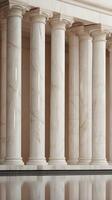 A vertical shot of sleek, smooth marble columns in neutral tones with soft reflections and copy space. photo